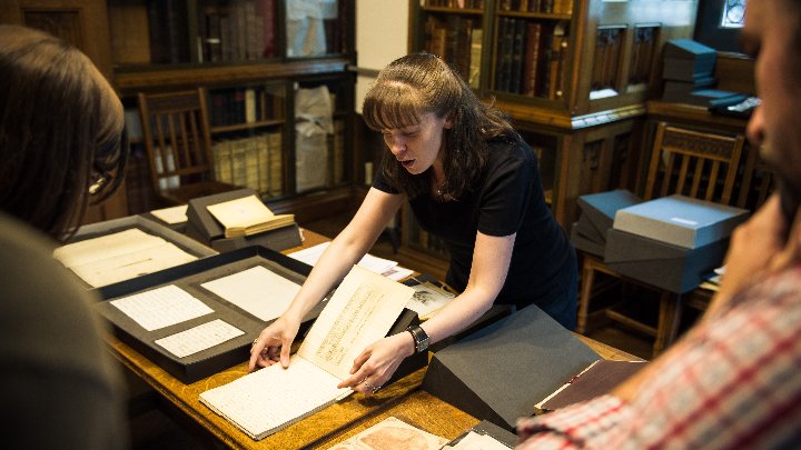 A woman inspecting some text