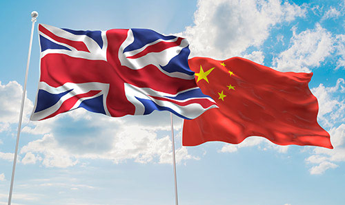 A British and Chinese flag next to each other.